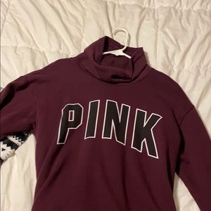 a maroon turtle neck sweater